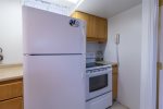 Lower Level Laundry Rm & Kitchen with Refrigerator & Stove